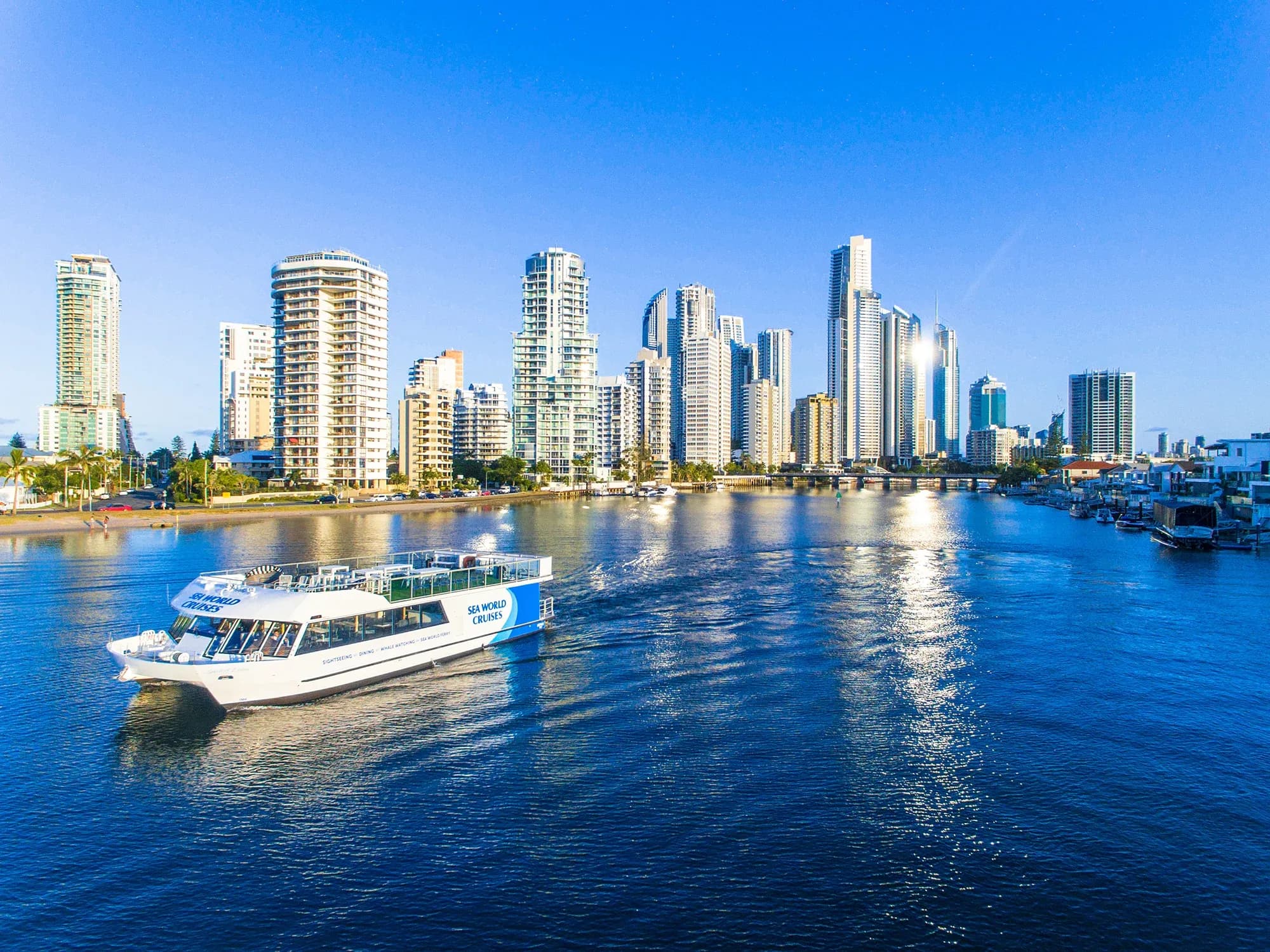 Spirit of Elston cruising the Gold Coast waterways beneath the Surfers Paradise skyline